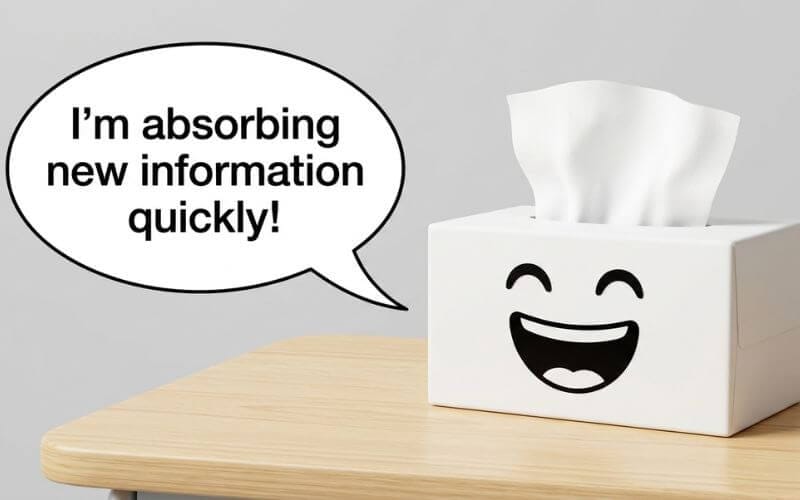 A simple 3D render of a laughing cartoon tissue box on a clean school desk with a clear speech bubble saying I'm absorbing new information quickly.