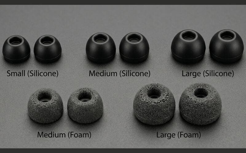 Multiple sizes of premium silicone and memory foam replacement ear tips for the best wireless earbuds under 200 dollars